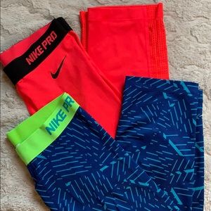 Two Nike Pro Dri-Fit Crop Leggings